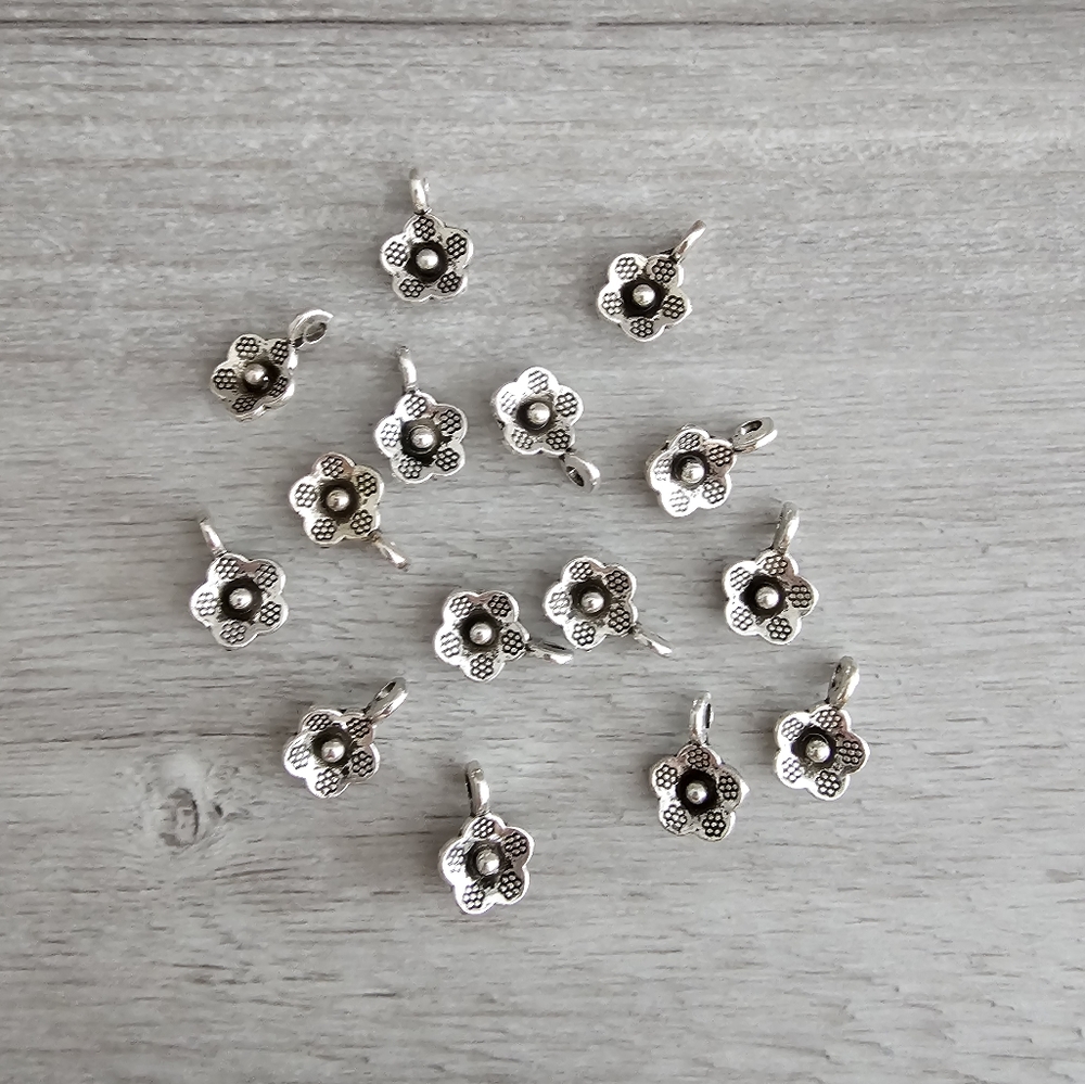 026 Silver Toned Flower Charms- 14 pc